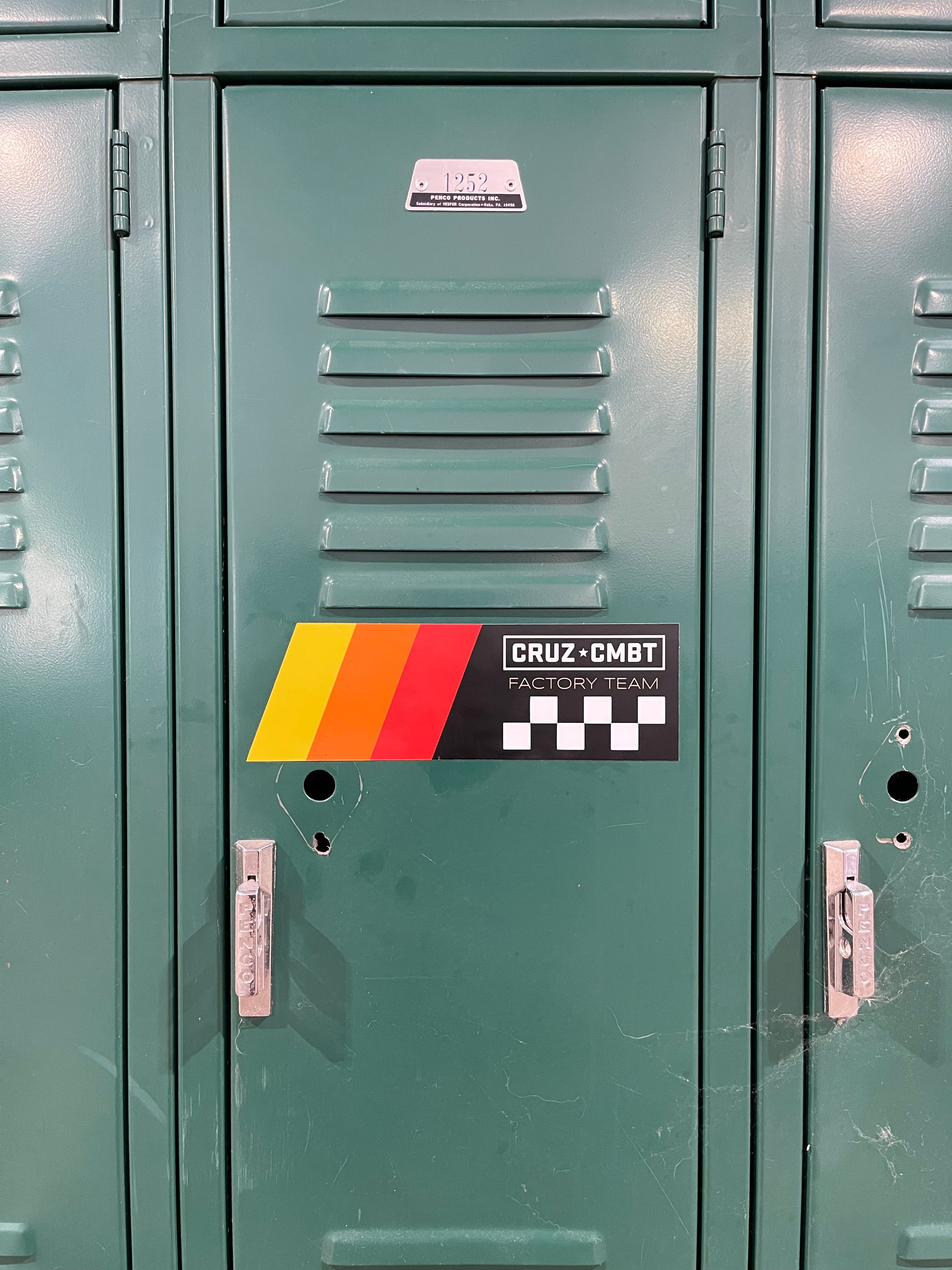 Factory Team sticker on a green metal locker