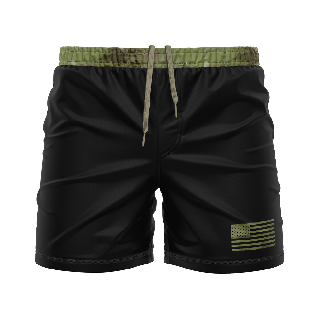 Black shorts with a green flag patch and camouflage waistband on a white background